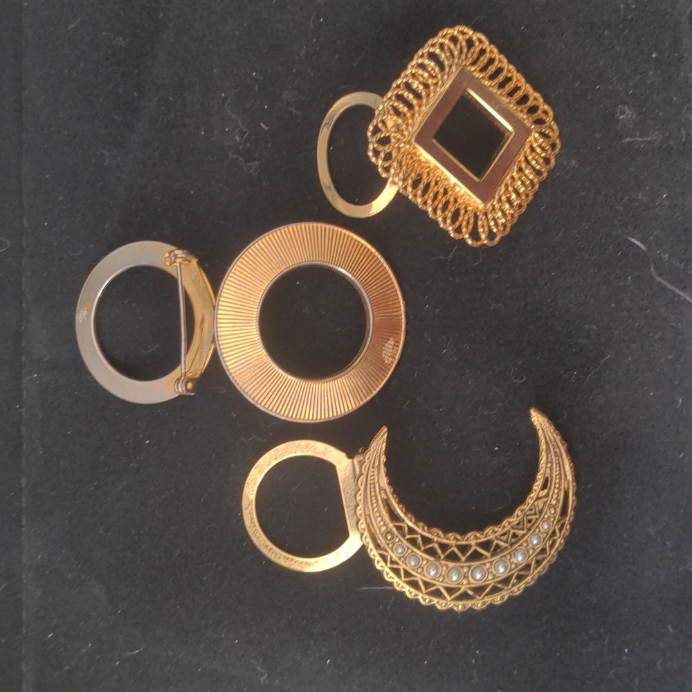 Set of three vintage scarf clips.